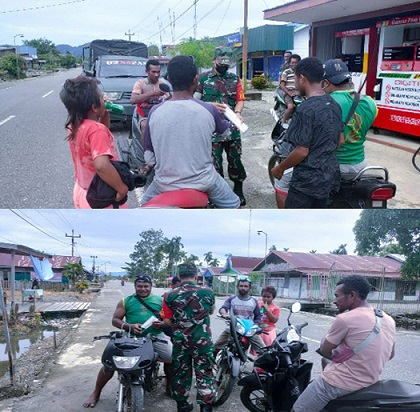 Babinsa Bagikan Masker Gratis di Distrik Makimi